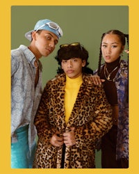 three girls in leopard coats posing for a photo