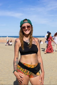 a woman standing on a beach