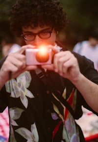 a person taking a picture with a camera