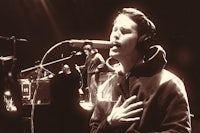 a man is singing into a microphone
