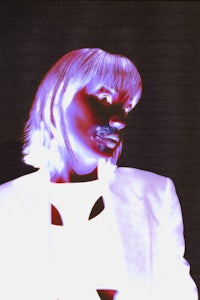 an image of a woman in a white suit