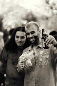 a man holding a beer