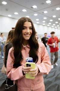 a woman wearing a pink jacket