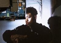 a man is sitting in front of a computer