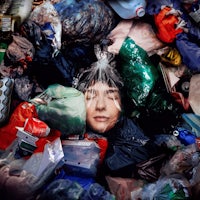 an image of a woman surrounded by plastic bags