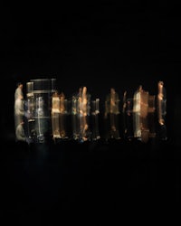 a blurry image of people standing in a dark room