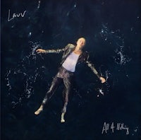 a man in a leather jacket floating in the water