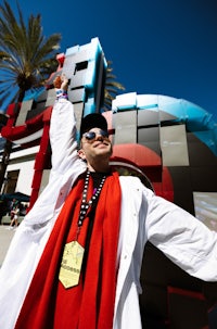 a man wearing a red and white coat