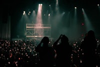 silhouettes of people at a concert