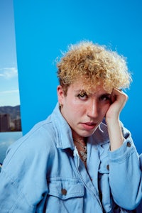 a woman wearing a blue denim jacket