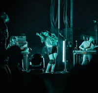 a group of people on stage at a concert