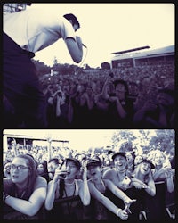 a man with a microphone in front of a crowd