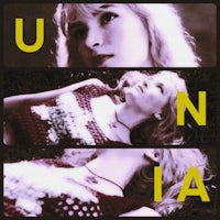 the cover of unina, with a woman laying on the ground