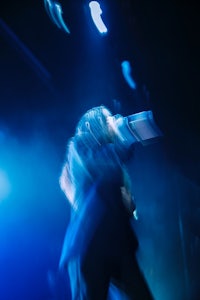 a person on stage with a microphone