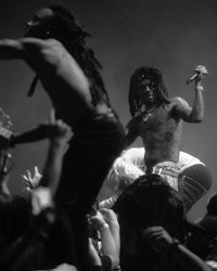 lil wayne performing at a concert in black and white