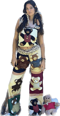 a woman in a teddy bear outfit standing next to a teddy bear