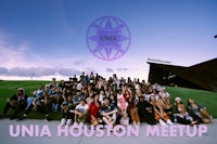 a group of people posing for a photo with the words unia houston